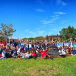 Large group of volunteers gathered for a community cleanup event