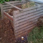 Wooden slatted backyard compost bin